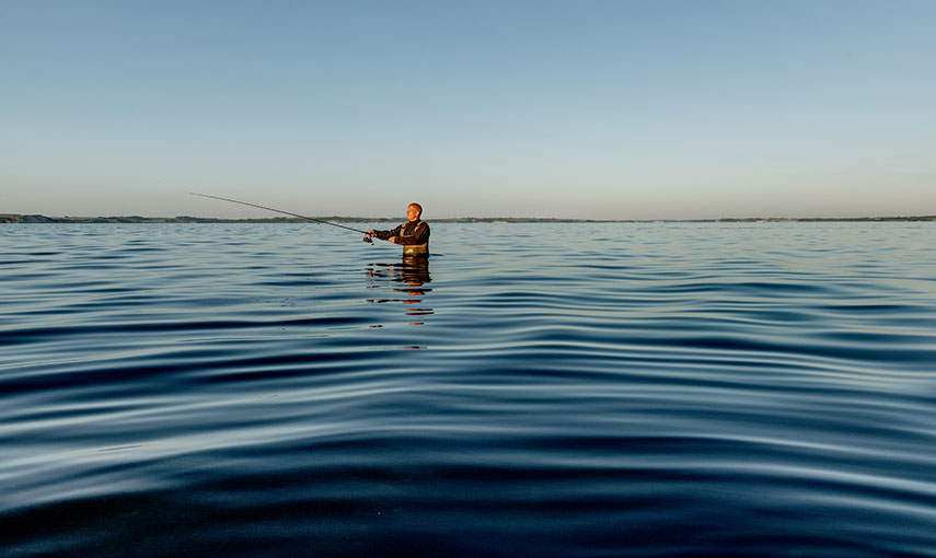 Fischer im Wasser